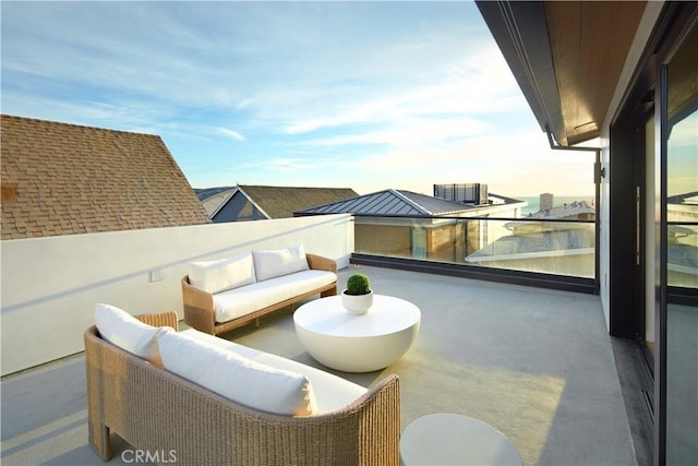 view of patio with an outdoor hangout area and a balcony