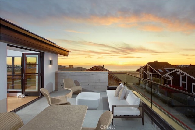 view of balcony at dusk