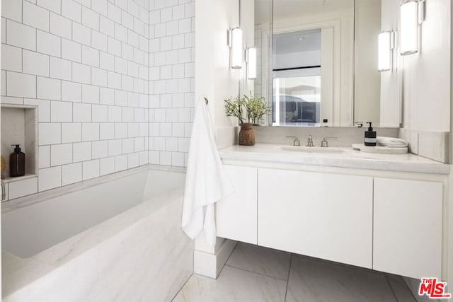 bathroom with vanity and tiled shower / bath