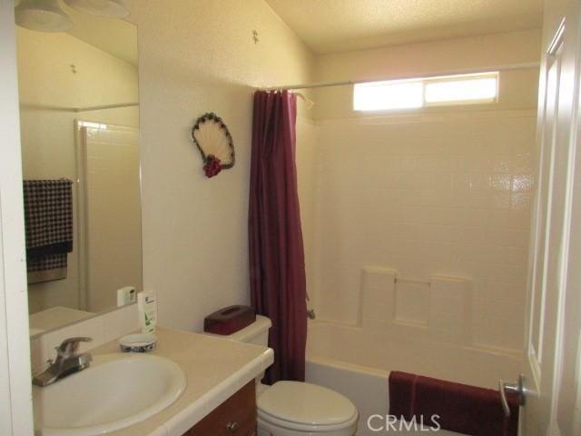 full bath with vanity, shower / bath combination with curtain, and toilet