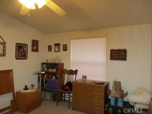 carpeted home office with ceiling fan