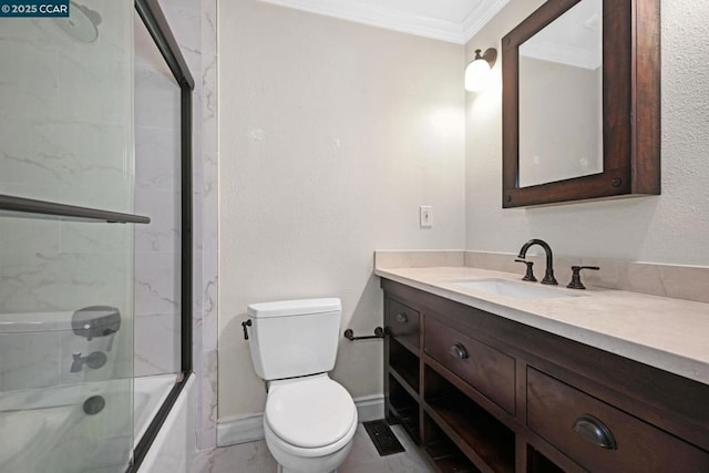 full bathroom featuring enclosed tub / shower combo, ornamental molding, vanity, and toilet