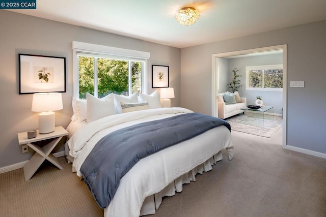 bedroom with light colored carpet