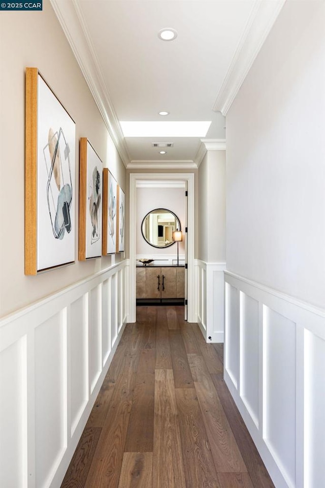 hallway with crown molding and dark wood-type flooring