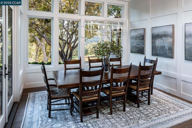 dining space featuring dark hardwood / wood-style floors