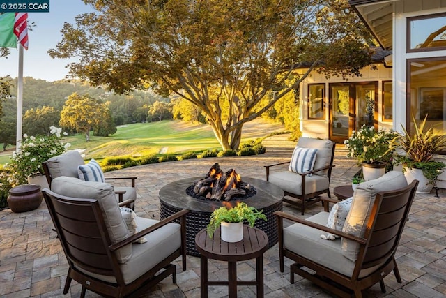 view of patio / terrace with a fire pit