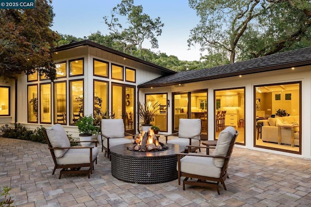 patio terrace at dusk with an outdoor fire pit