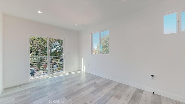 unfurnished room featuring light hardwood / wood-style flooring