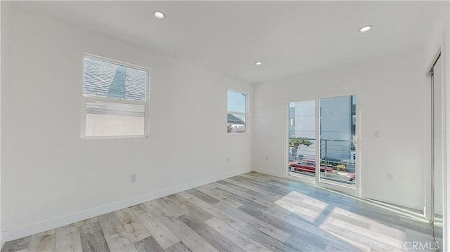 unfurnished room featuring light hardwood / wood-style flooring