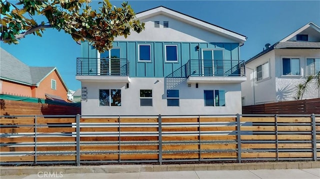 236 N Burlington, Los Angeles, CA 90026 - view of front of home featuring a balcony, stucco siding, and board and batten siding