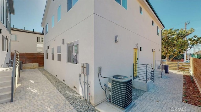 236 N Burlington, Los Angeles, CA 90026 - view of side of home with stucco siding, crawl space, and a patio