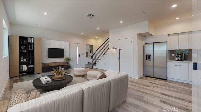 236 N Burlington, Los Angeles, CA 90026 - living room with light wood finished floors, stairway, and recessed lighting