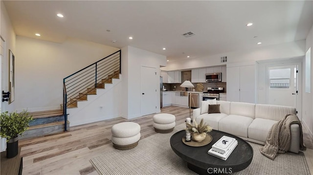 236 N Burlington, Los Angeles, CA 90026 - living room with light wood-type flooring, stairs, and recessed lighting