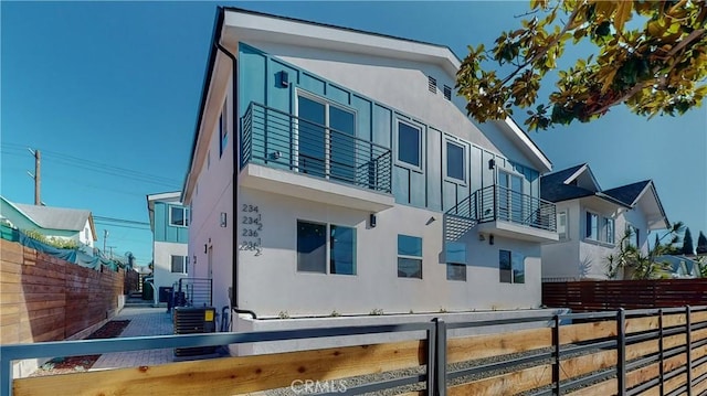 236 N Burlington, Los Angeles, CA 90026 - view of property exterior featuring stucco siding and a balcony