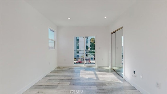 unfurnished room featuring light hardwood / wood-style floors