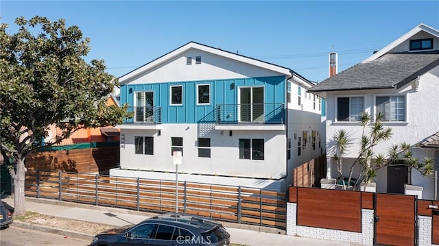 view of front of house with a balcony