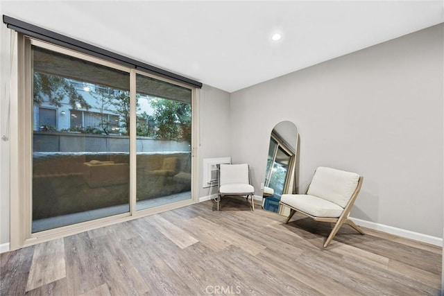 unfurnished room featuring hardwood / wood-style flooring and floor to ceiling windows