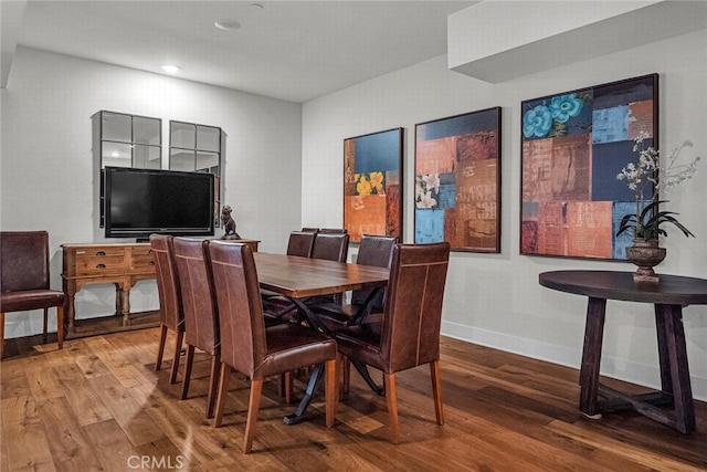 dining area with wood-type flooring