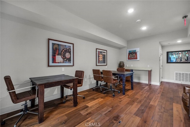 dining space featuring dark wood-type flooring