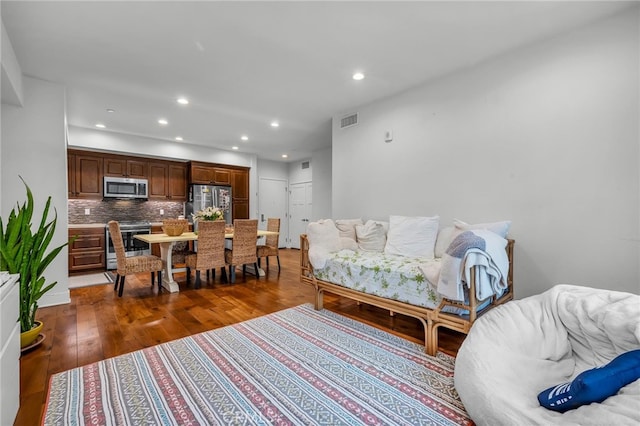 living room with dark hardwood / wood-style flooring