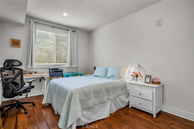 bedroom featuring dark wood-type flooring