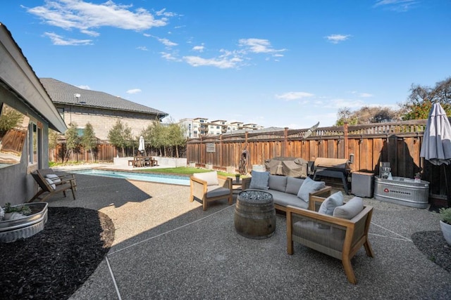 view of patio / terrace featuring a fenced in pool and outdoor lounge area