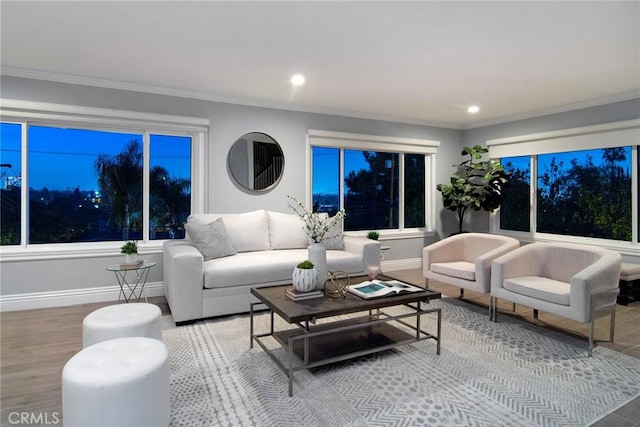 living room featuring wood-type flooring and ornamental molding