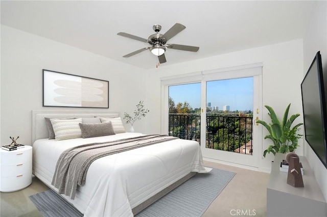 bedroom featuring access to exterior and ceiling fan