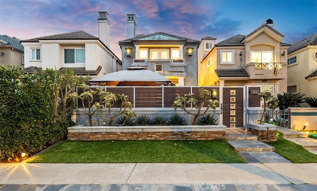 view of front of home with a balcony