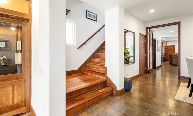 stairs featuring recessed lighting and baseboards