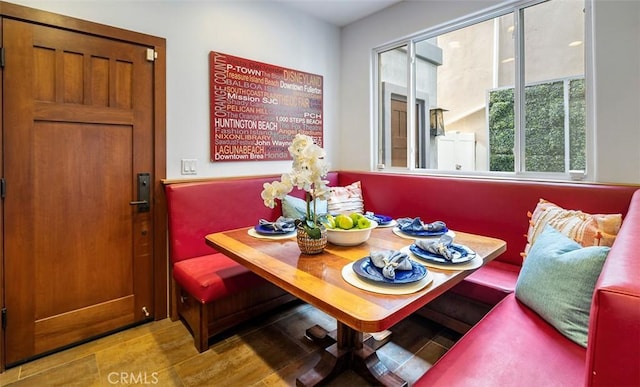 dining space featuring breakfast area and light wood-type flooring