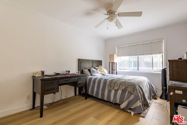 bedroom featuring ornamental molding, ceiling fan, and light wood-type flooring