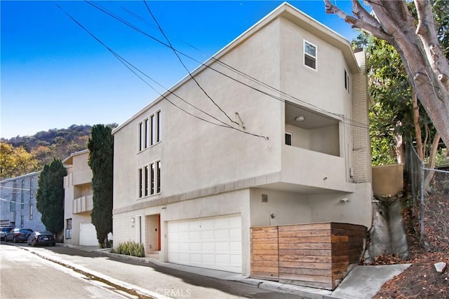 view of side of home featuring a garage