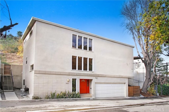 view of front of property with a garage