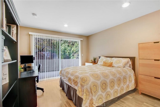 bedroom with access to outside, light wood-type flooring, and recessed lighting