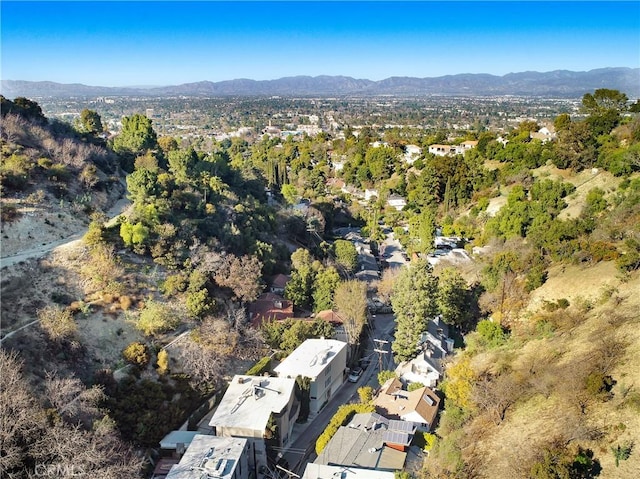 bird's eye view featuring a mountain view and a view of trees