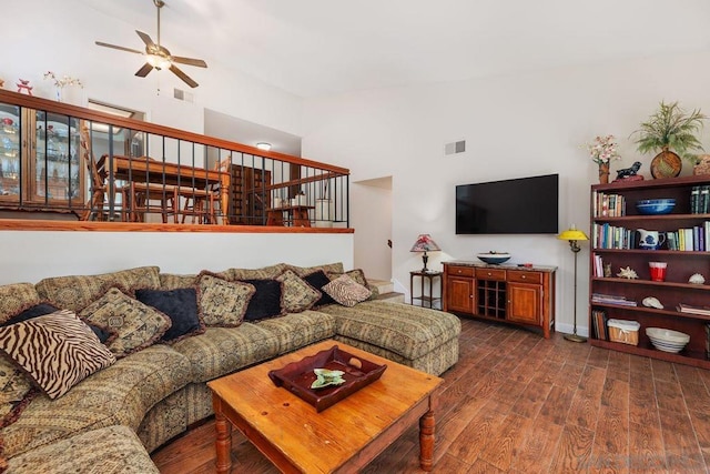 living room with high vaulted ceiling, dark hardwood / wood-style floors, and ceiling fan