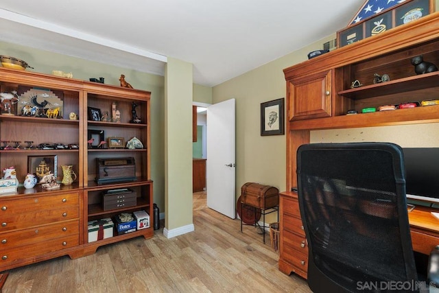 office space with light wood-type flooring