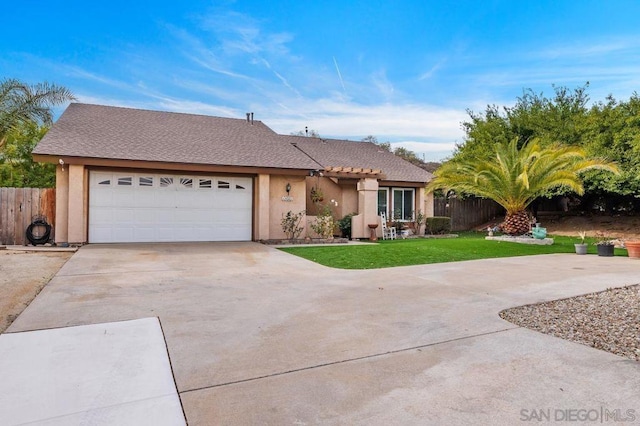 ranch-style home with a garage and a front yard