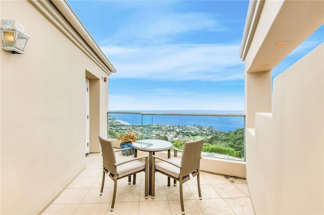 balcony featuring a water view