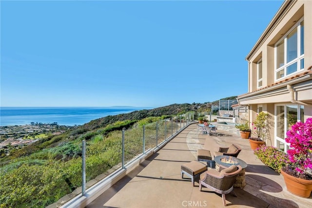 view of patio / terrace with a water view