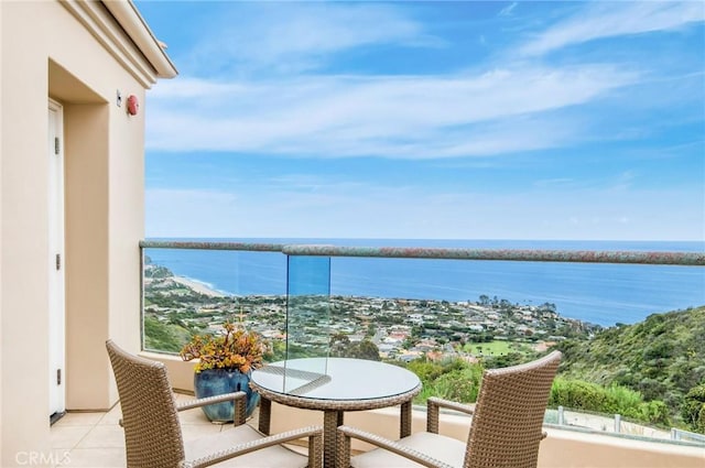 balcony featuring a water view