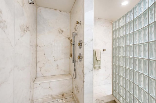 bathroom with tiled shower