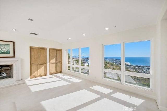 living room with a water view and a wealth of natural light