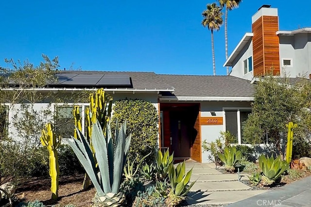 doorway to property with solar panels