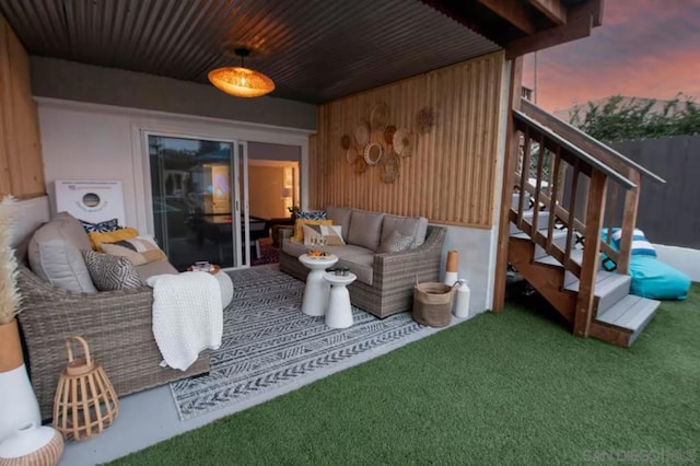 exterior space featuring an outdoor living space and a yard