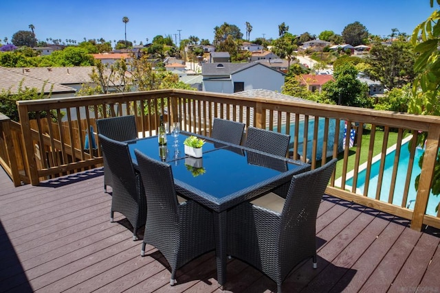 wooden deck with a swimming pool