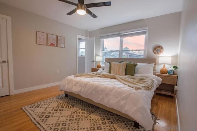 bedroom with wood-type flooring and ceiling fan