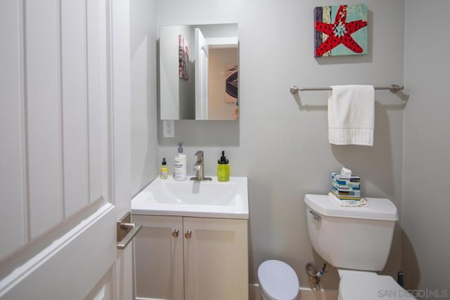 bathroom featuring vanity and toilet