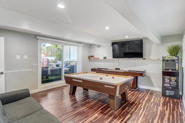 rec room featuring dark hardwood / wood-style flooring and beam ceiling